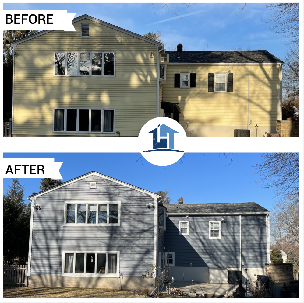 After — colonial rear with new gray siding and updated windows