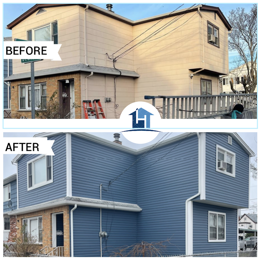 After — two-family home with new periwinkle blue siding and white trim